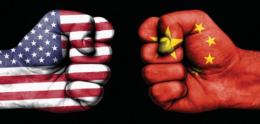 Composite image of fists with the U.S. and Chinese flag on the overlay.